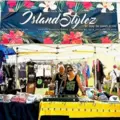 Maria and Tim Santos at a festival, in their booth